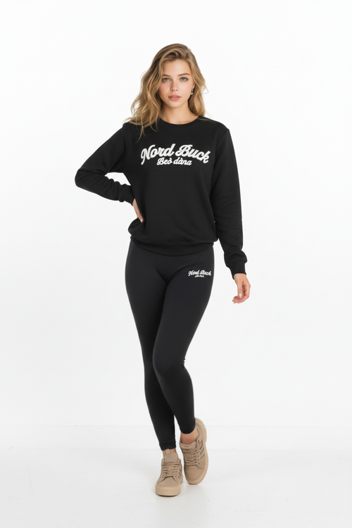 Woman wearing a black sweatshirt and leggings with 'Nordic Back' branding on a white background