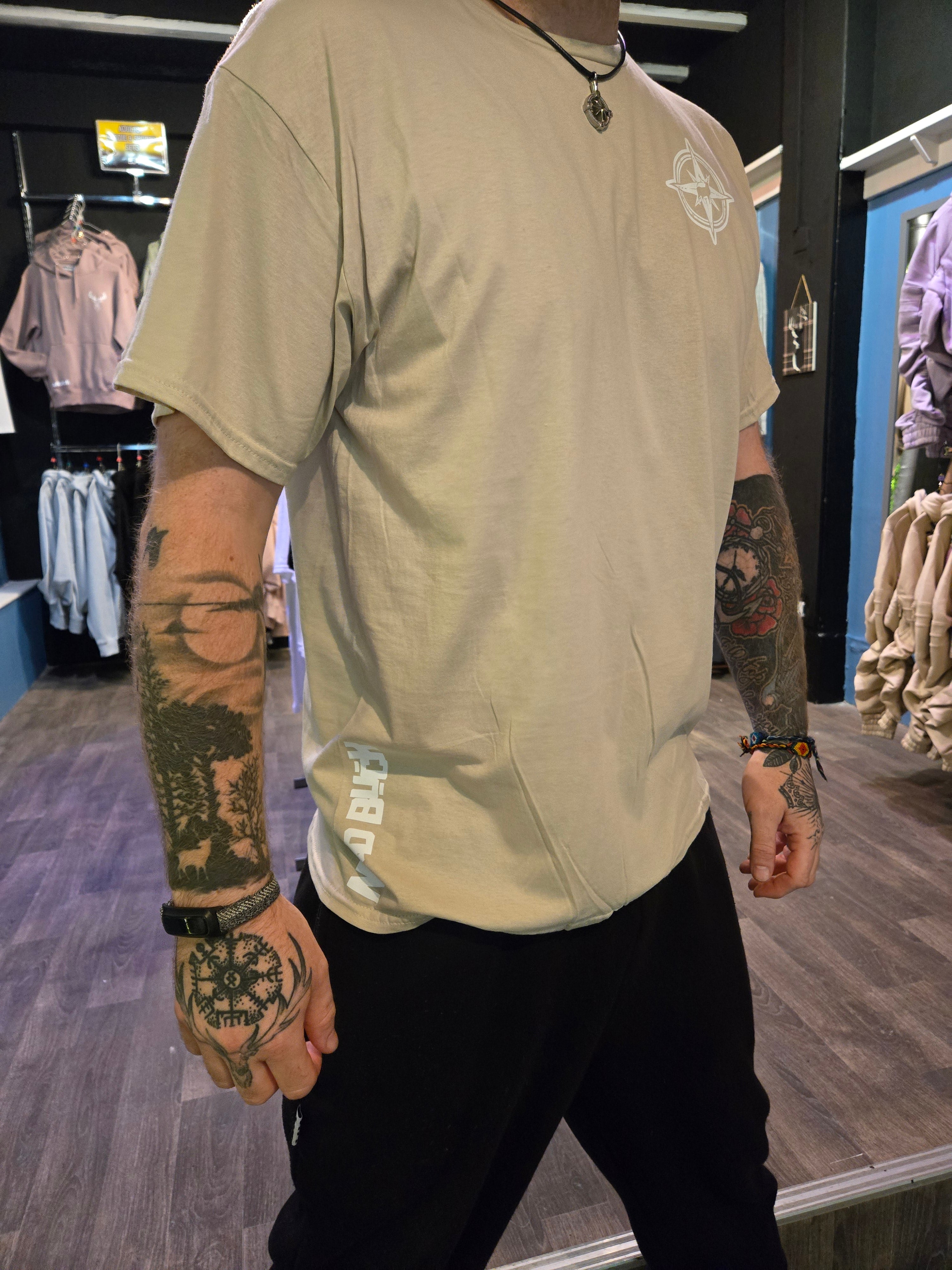 Person wearing a beige top with  standing inside Nord Buck.