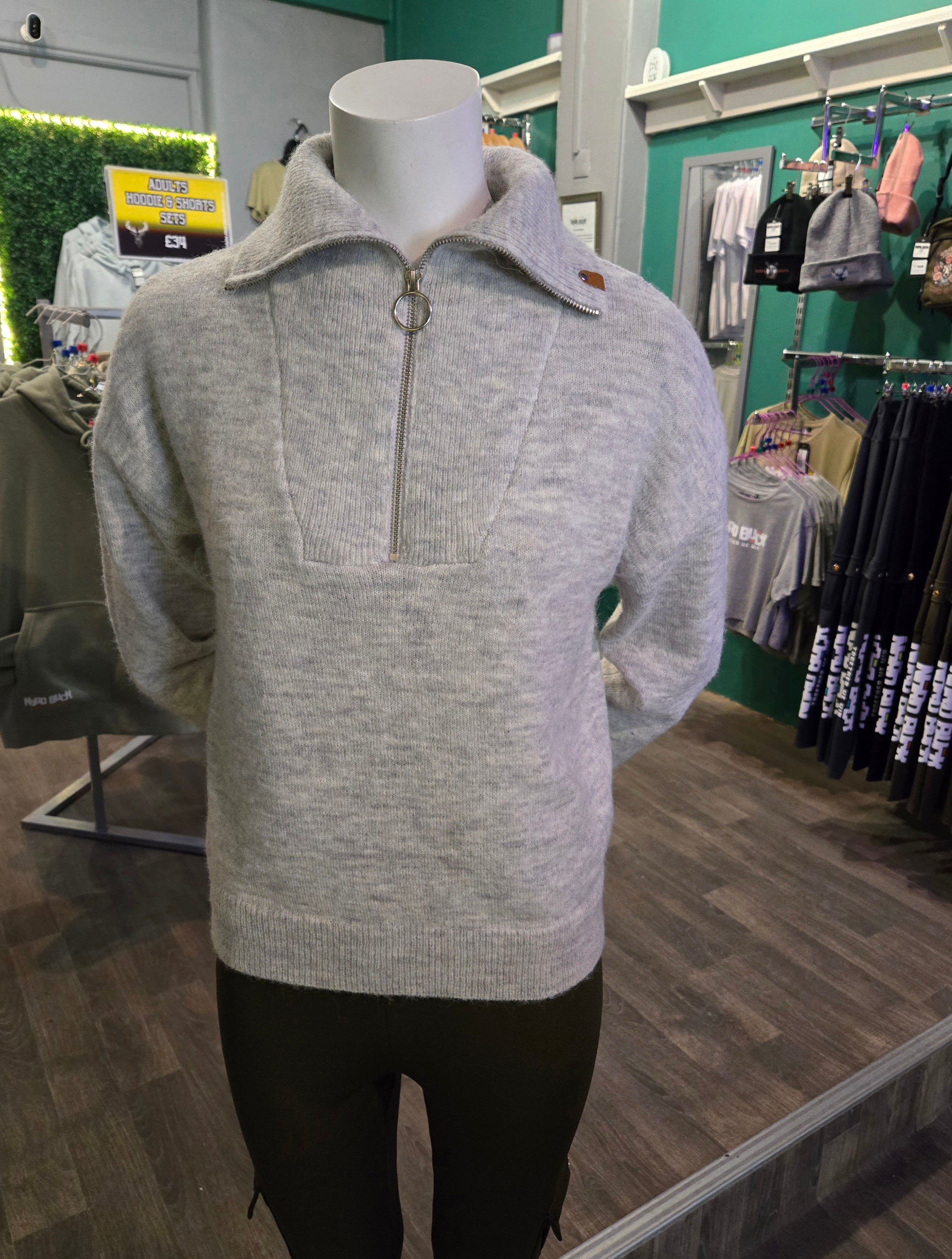 Gray sweater on a mannequin in a store setting Nord Buck