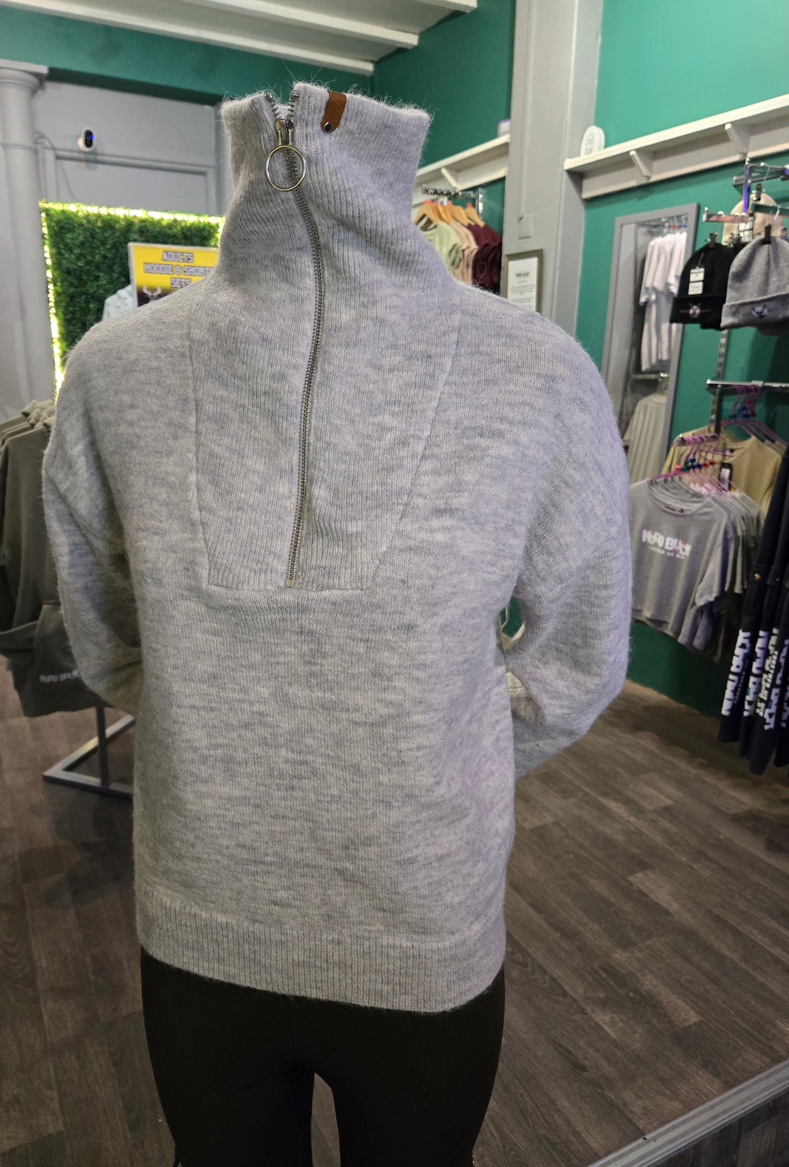 Gray sweater on a mannequin in a store setting Nord Buck