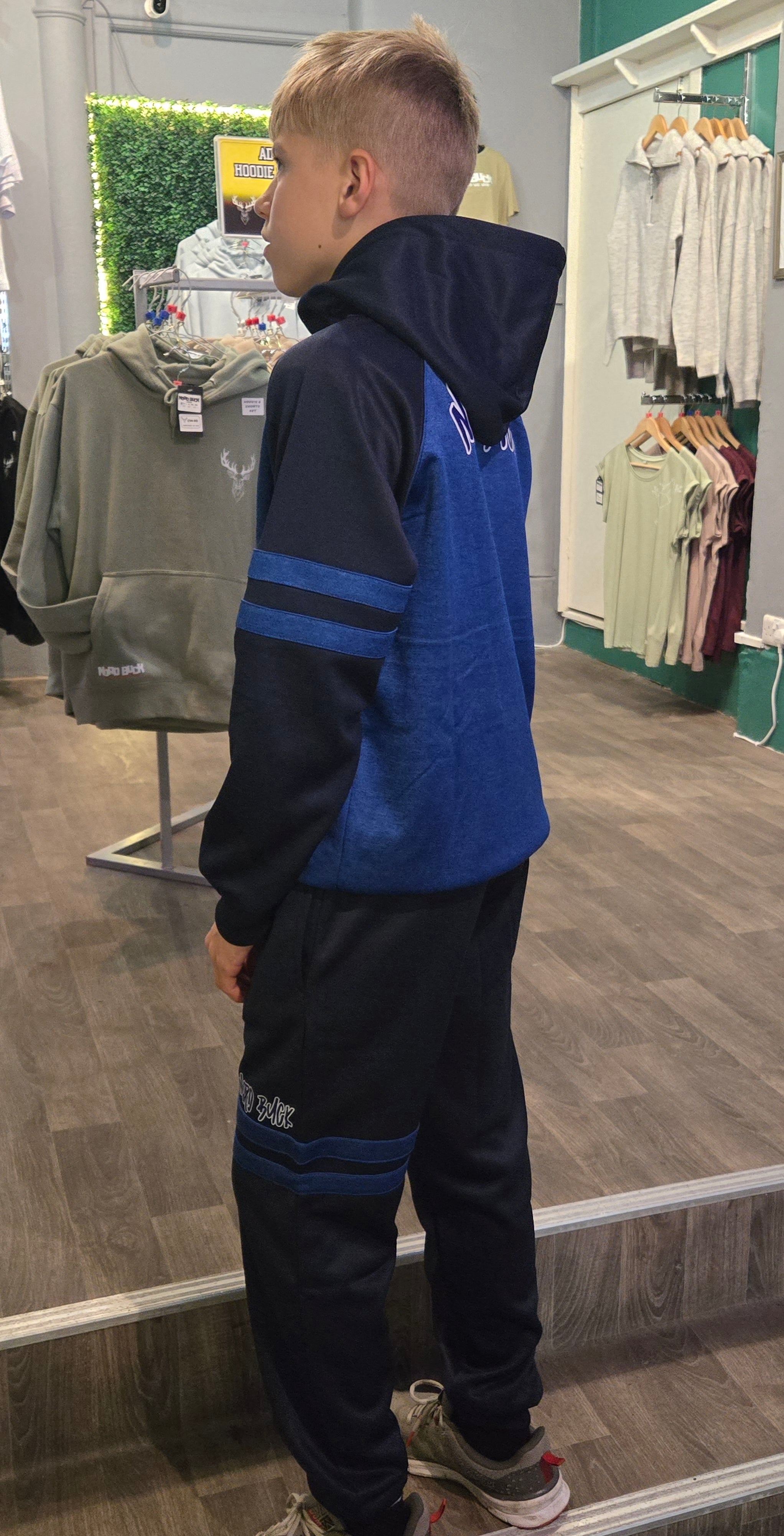 Teenager wearing Blue Nord Buck Tracksuit
