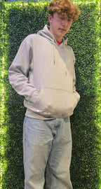 Older teenager wearing grey hoodie from Nord Buck with stag logo on the chest 