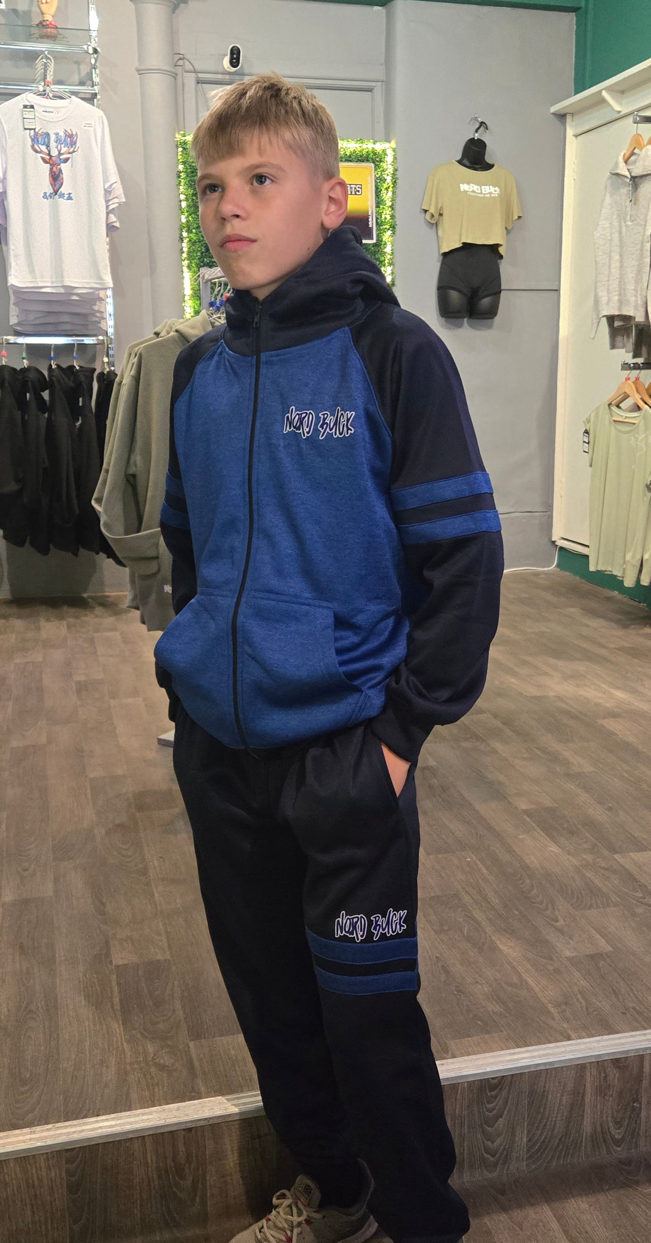 Teenager wearing Blue Nord Buck Tracksuit