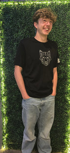 Man wearing black tshirt with silver stag logo on