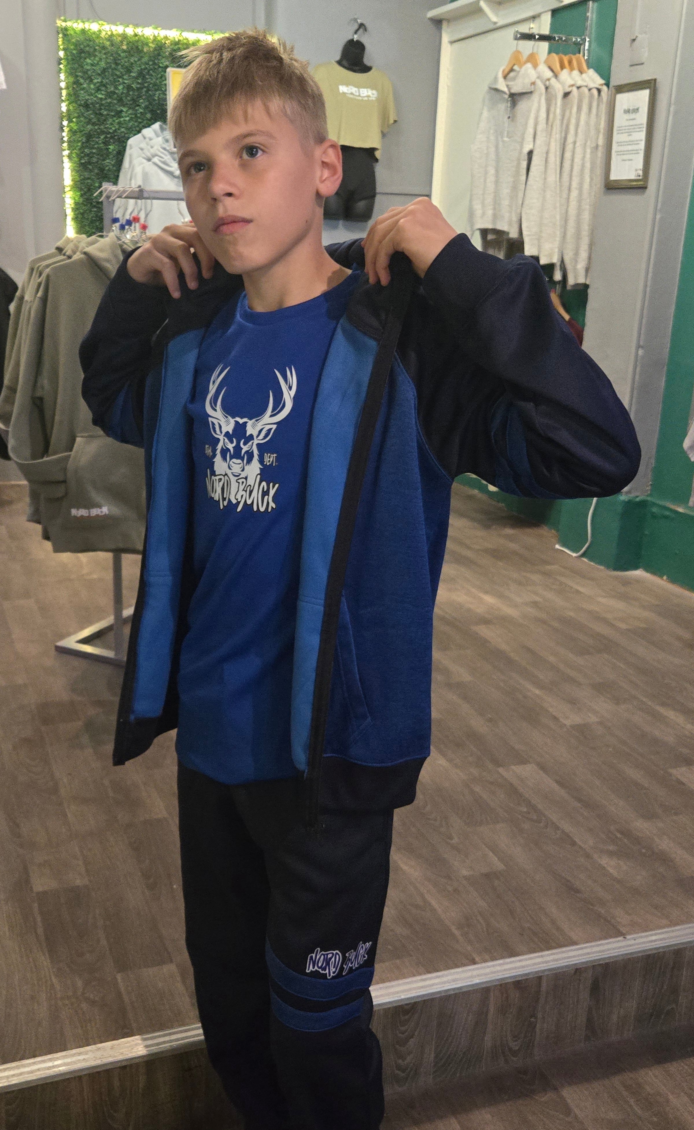 Teenager wearing Blue Nord Buck Tracksuit