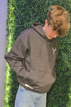 Older teenager wearing charcoal hoodie 