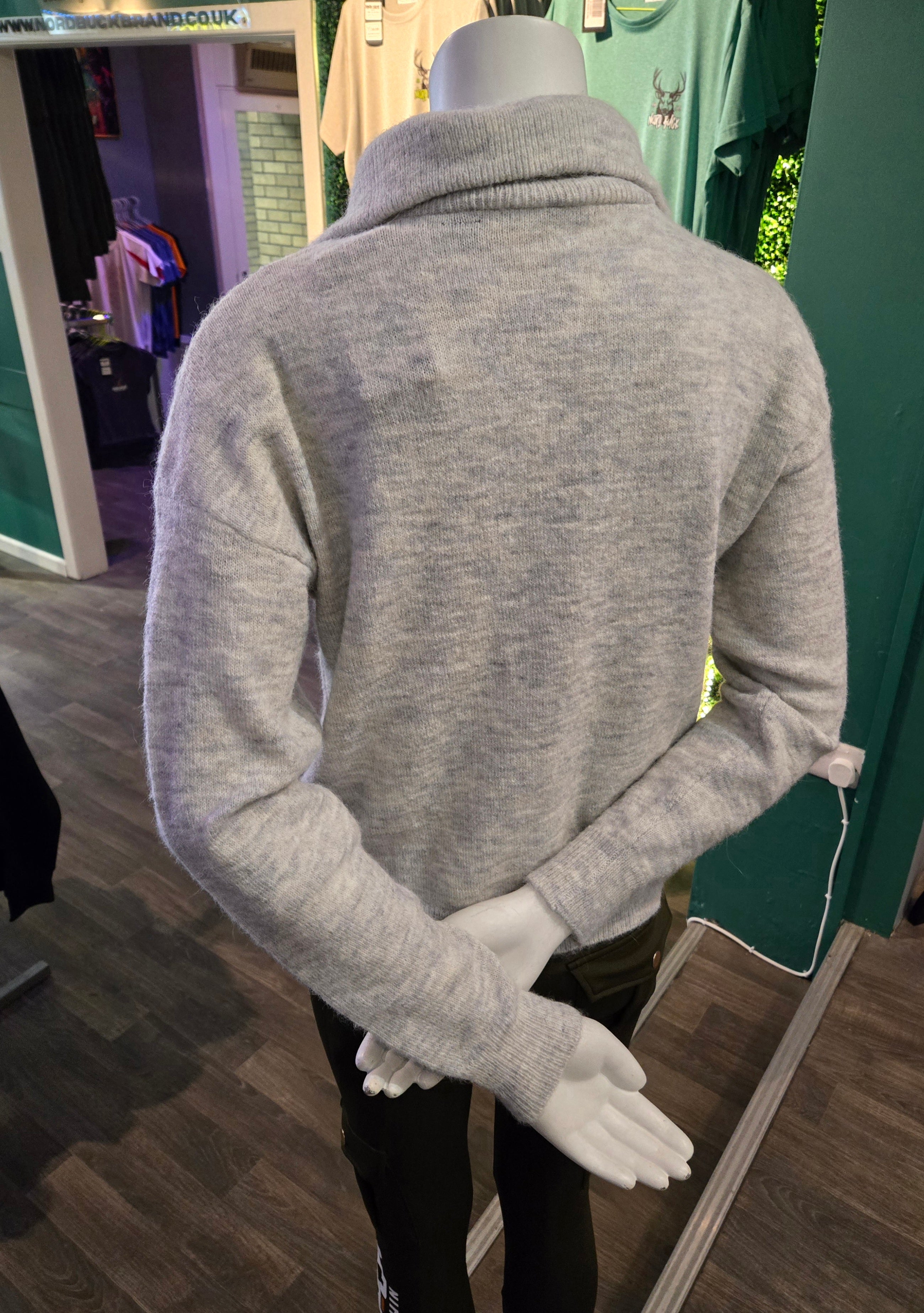 Gray sweater on a mannequin in a store setting Nord Buck
