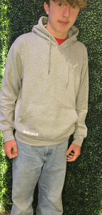 Older teenager wearing grey hoodie from Nord Buck with stag logo on the chest 